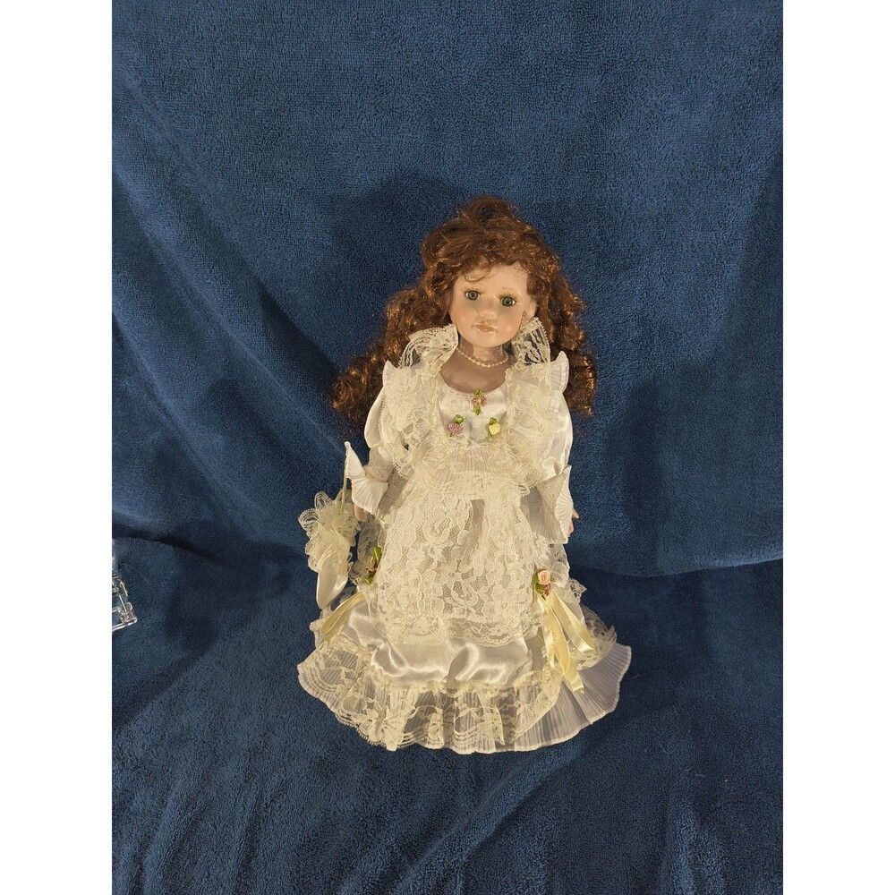 Porcelain Doll with Satin And Lace Dress and Curly Hair "Cathay Collection"